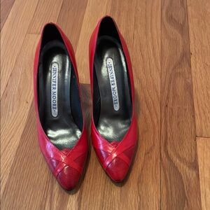 Red leather high heeled pumps